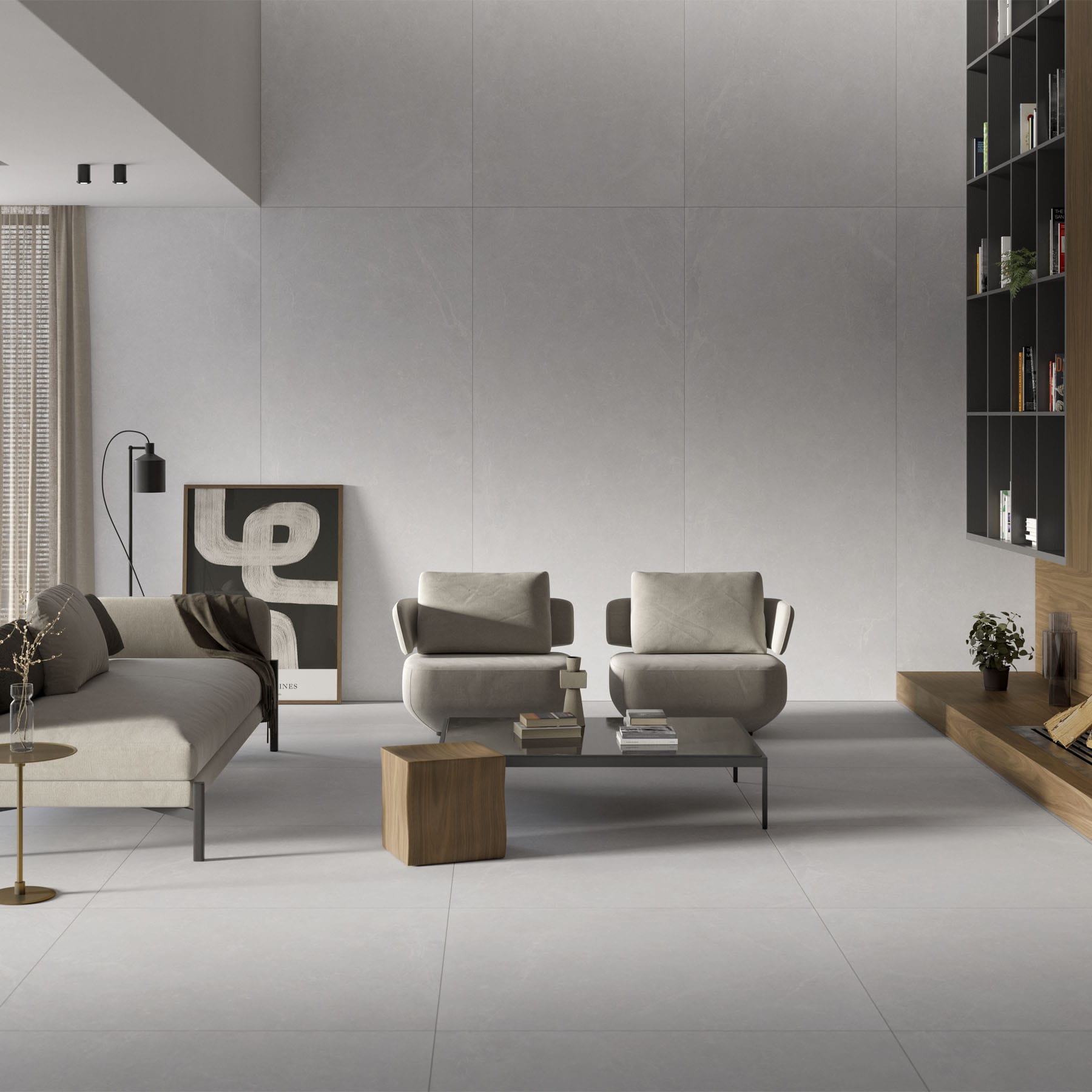 Salón luminoso con suelo porcelánico claro de gran formato y sillones