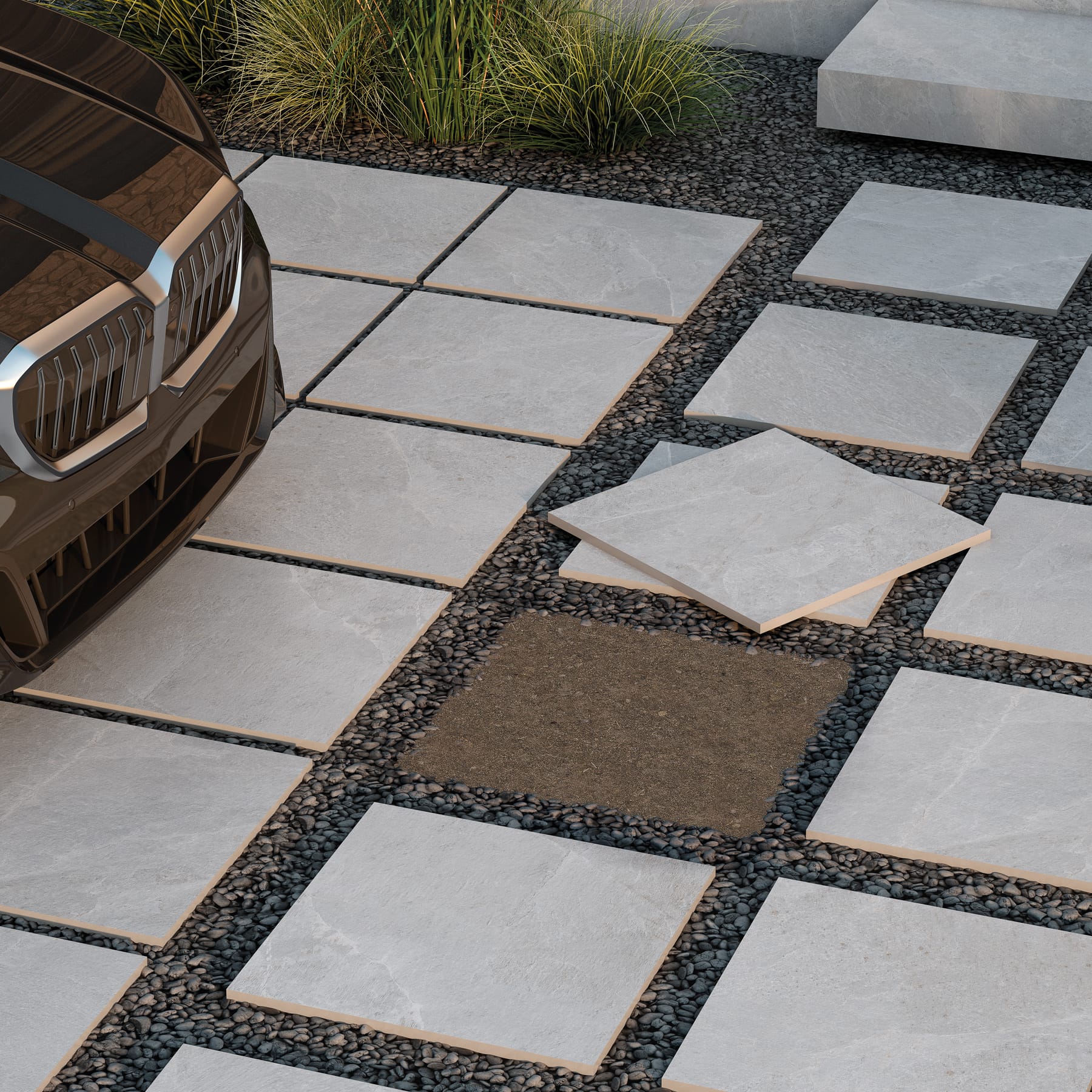 Losas porcelánicas de exterior de 20 mm sobre grava en una entrada